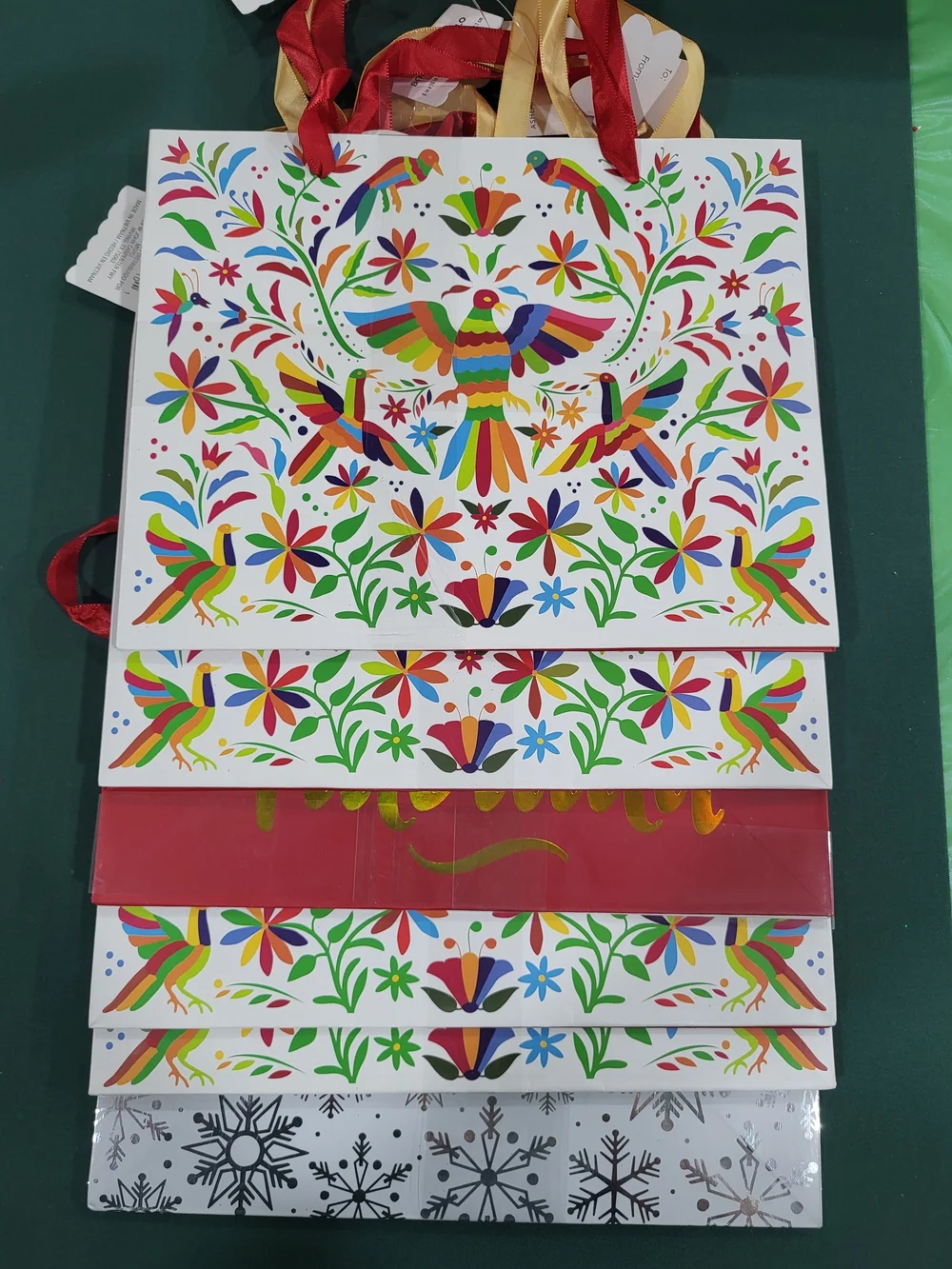 Holiday Time Feliz Navidad Red and Gold Gift Bags with Colorful Folk Art